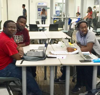 Group of students working on laptops at the AABSSC